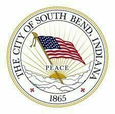 City of South Bend, Indiana seal featuring a waving American flag, rising sun, and the word "Peace."