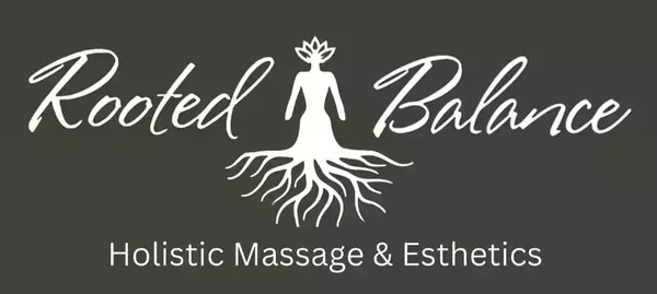 White logo on a dark background for "Rooted Balance", featuring a stylized human figure with a lotus flower head and roots instead of legs. Beneath it, "Holistic Massage & Esthetics" is written.